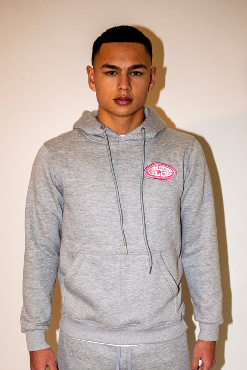 PR1VATE Kapuzenpullover mit rosa Emblem